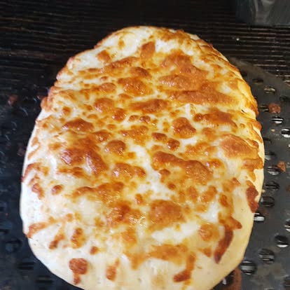 Cheesy calzone on the oven rack