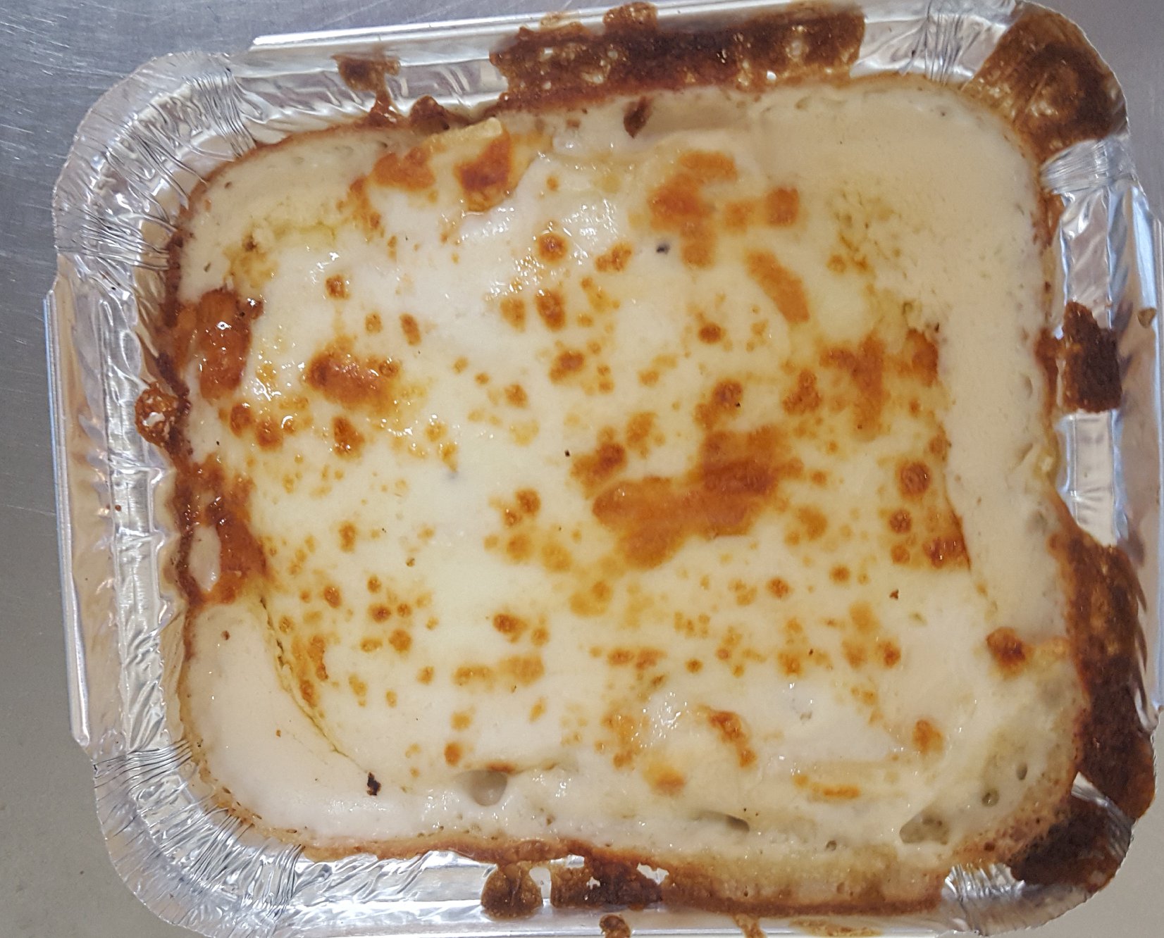 Baked lasagna topped with melted cheese